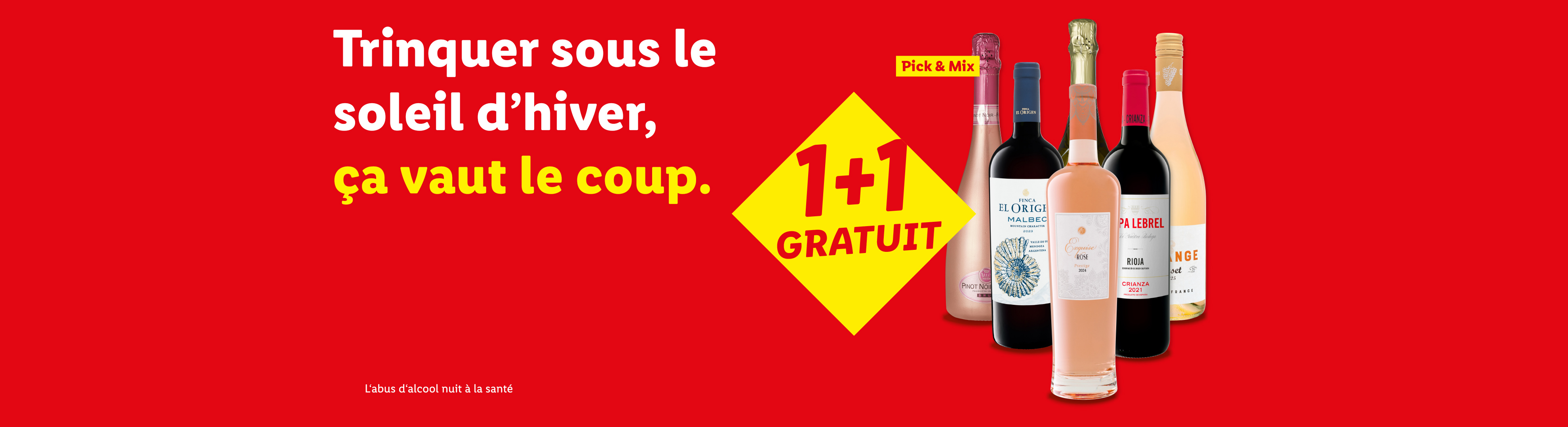 Bouteilles de vin et de mousseux avec une offre 1+1 gratuit et le texte 'Trinquer sous le soleil d'hiver, ça vaut le coup.'